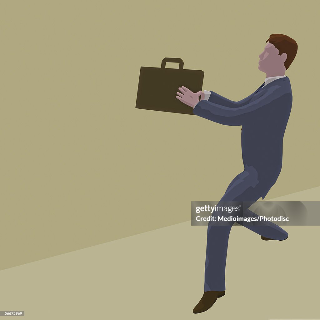 Side profile of a businessman holding a briefcase