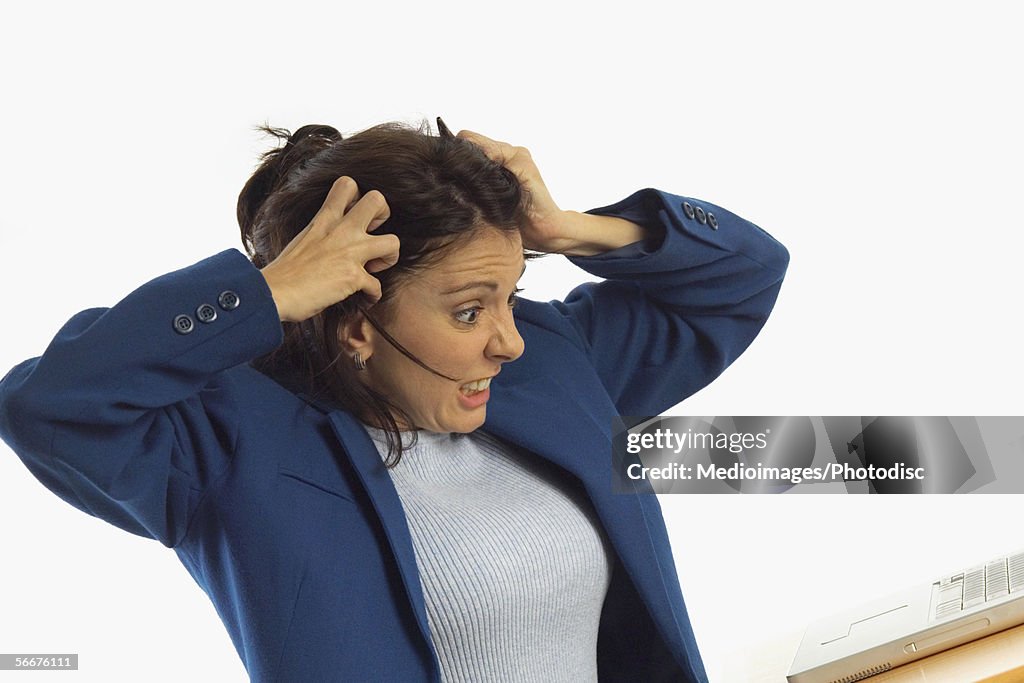 Close-up of a businesswoman scratching her head