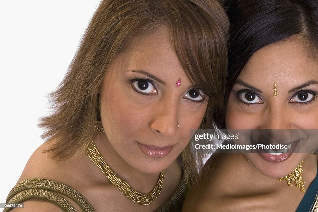 Portrait of two young women wearing Indian traditional clothing