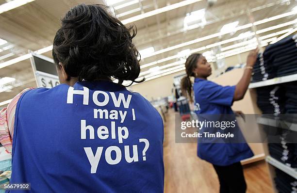 Wal-Mart sales associates arrange clothing at a new Wal-Mart store January 26, 2006 in Evergreen Park, Illinois. Wal-Mart reportedly had at this...