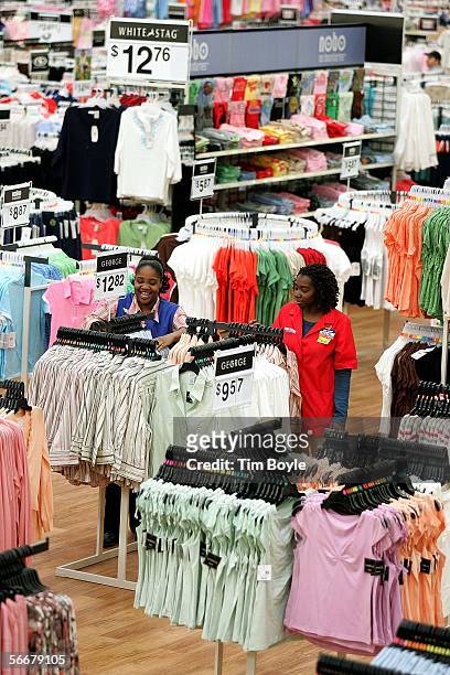 Wal-Mart sales associates arrange clothing at a new Wal-Mart store January 26, 2006 in Evergreen Park, Illinois. Wal-Mart reportedly had over 25,000...