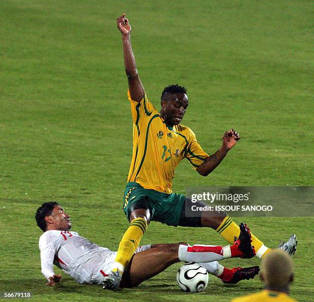 South Africa's Benni McCarthy fights for the ball with Anis Ayari of Tunisia during their Group C African Nations Cup football match in Alexandria,...