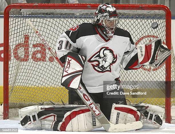 Ryan Miller of the Buffalo Sabres makes a glove save during warmups before their NHL game against the Toronto Maple Leafs at the Air Canada Centre...