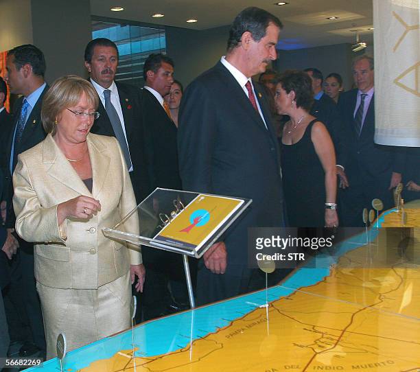 Mexican President Vicente Fox and Chilean President elect Michelle Bachelet visit the newly inaugurated La Moneda Cultural Centre in Santiago, 26...