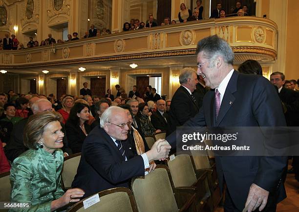 Austrian President Heinz Fischer welcomes former German President Roman Herzog at the opening of the Mozart week at the Mozarteum on January 27, 2006...