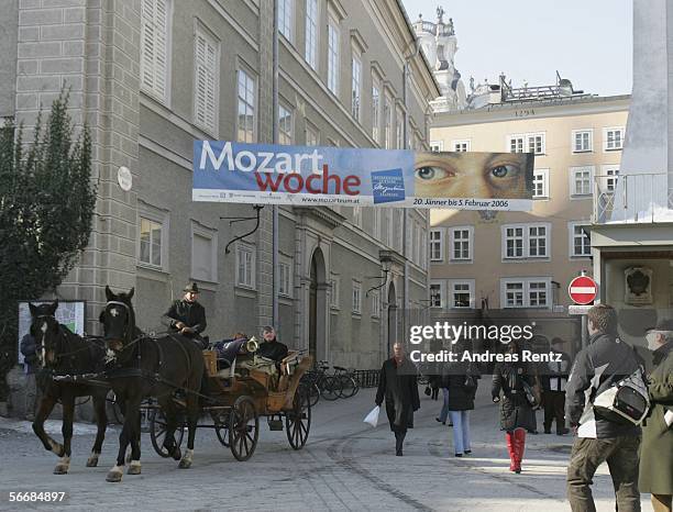 Horse-drawn carriage rides through the city at the opening of the Mozart week on January 27, 2006 in Salzburg, Austria. Salzburg celebrates the 250th...