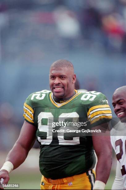 Defensive lineman Reggie White of the Green Bay Packers on the field after a game against the Cleveland Browns at Municipal Stadium on November 19,...