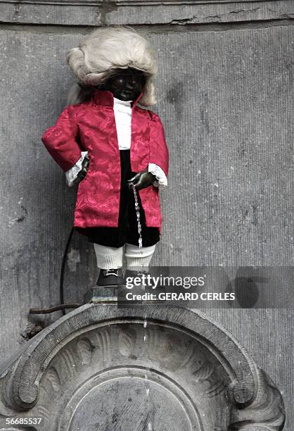 The famous landmark of Brussels, the little fountain 'Manneken Pis' is dressed in a Mozart costume, 27 January 2006. Today is the 250th anniversary...