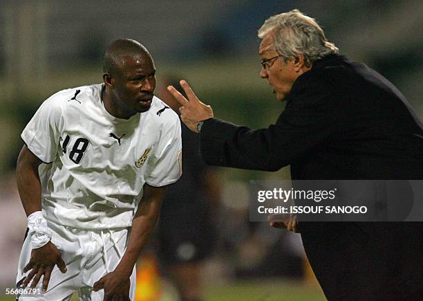 Ghanaian team coach Ratomir Dujkovic from Serbia, gives instructions to Abubakari Yakubu during the knock-out round game between Ghana's Black Stars...