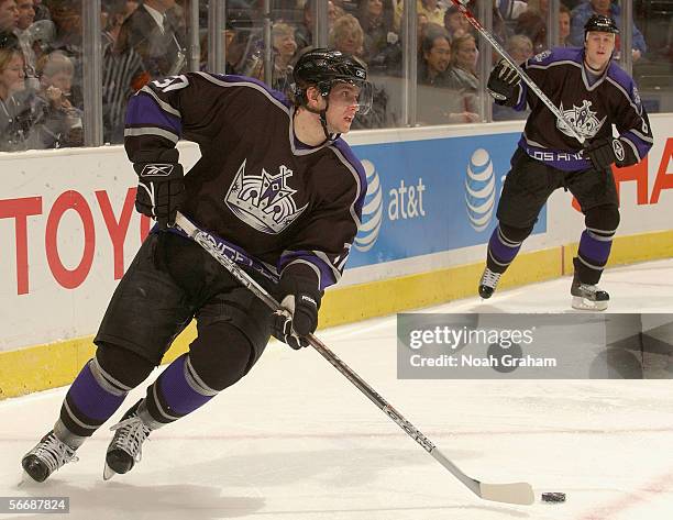 Denis Gerbeshkov of the Los Angeles Kings skates with the puck against the Tampa Bay Lightning during the NHL game on January 17, 2006 at the Staples...