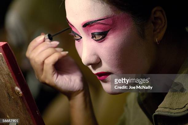 An Actor in the Beijing Opera theater applies makeup prior to performance of the Monkey King on September 25, 2005 in Beijing, China.