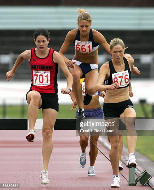 Kate McIlroy runs on her way to a win in the Senior Women's 3000m steeplechase ahead of second placed Fiona Crombie and 3rd placed Rebecca Furlong at...