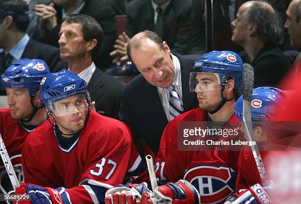 Head coach Bob Gainey of the Montreal Canadiens looks in on Chris Higgins during the game against the Dallas Stars at the Bell Centre on January 16 ,...