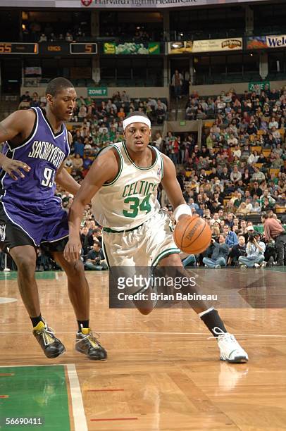 Paul Pierce of the Boston Celtics drives against Ron Artest of the Sacramento Kings January 27, 2006 at the TD Banknorth Garden in Boston,...