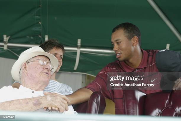 Tiger Woods shakes Byron Nelson's hand during the final round of the 2002 Verizon Byron Nelson Classic at TPC Las Colinas Golf Course in Irving,...