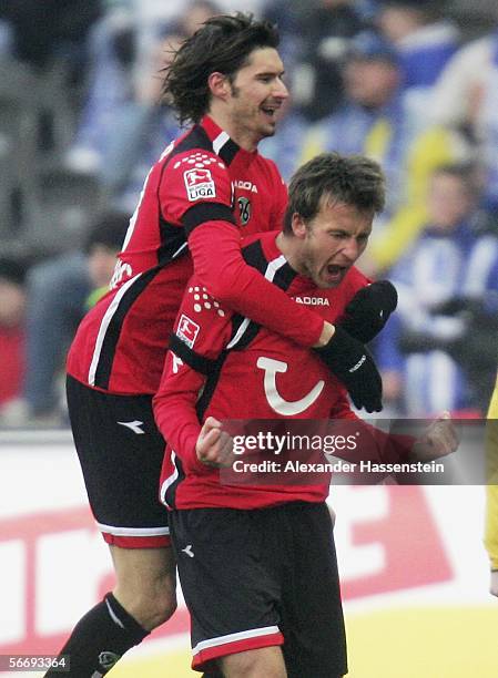 Christoph Dabrowski of Hanover celebrates after scoring the fisrt goal with Thomas Brdaric of Hanover during the Bundesliga match between Hertha BSC...