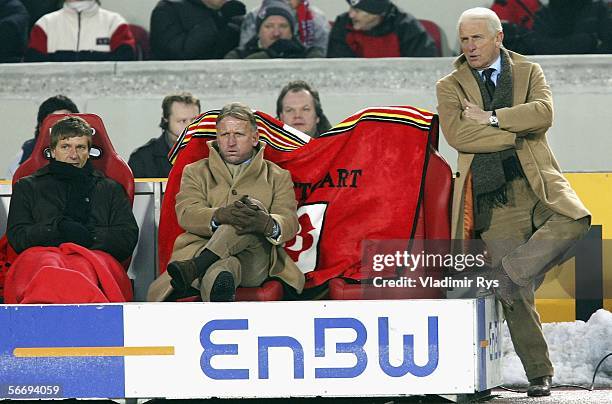 Manager Horst Heldt, Assistant Andreas Brehme and Coach Giovanni Trapattoni of Stuttgart look on during the Bundesliga match between VFB Stuttgart...