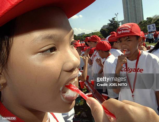 Some 10,800 primary school children join a Philippine attempt to break a Guinness Book of World Records entry on the most number of people brushing...
