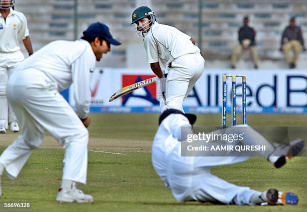 Pakistani cricketer Salman Butt looks back to see Indian captain Rahul Dravid take a slip catch to dismiss him for a duck during the first day of the...