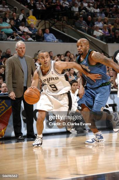 Tony Parker of the San Antonio Spurs drives against Anthony Carter of the Minnesota Timberwolves during the game at the AT&T Center on January 28,...