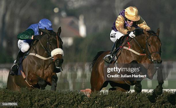 Tony McCoy and Brave Inca lead the Barry Geraghty ridden Macs Joy over the last flight to land The AIG Europe Champion Hurdle Race run at...