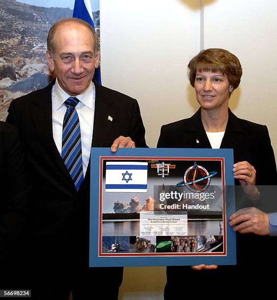 In this handout from the Israeli Government Press Office , acting Israeli Prime Minister Ehud Olmert meets Commander Eileen Collins in his office on...