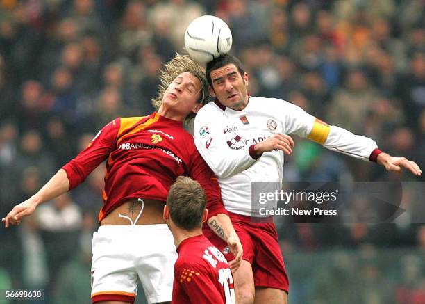 Cristiano Lucarelli of Livorno and Phillipe Mexes of Roma in action during the Serie A match between AS Roma and Livorno at the Stadio Olimpico on...