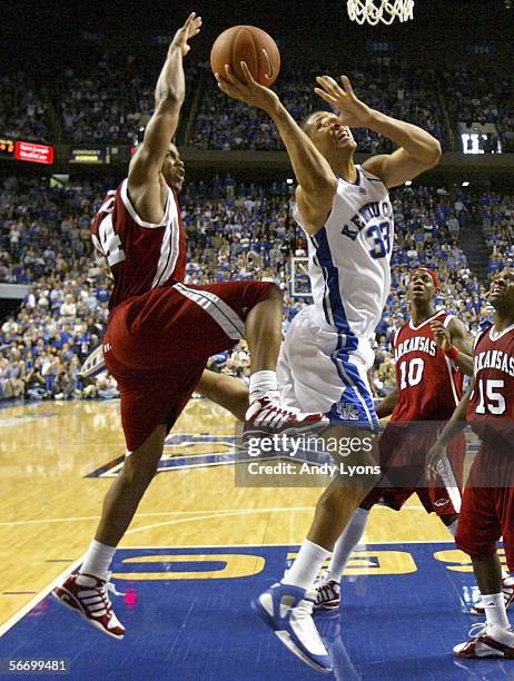 Randolph Morris of the Kentucky Wildcats shoots the ball while defended by Jonathon Modica of the Arkansas Razorbacks during the SEC game on January...