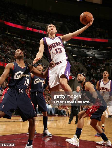 Steve Nash of the Phoenix Suns puts up a layup past Damon Jones of the Cleveland Cavaliers on January 29, 2006 at The Quicken Loans Arena in...