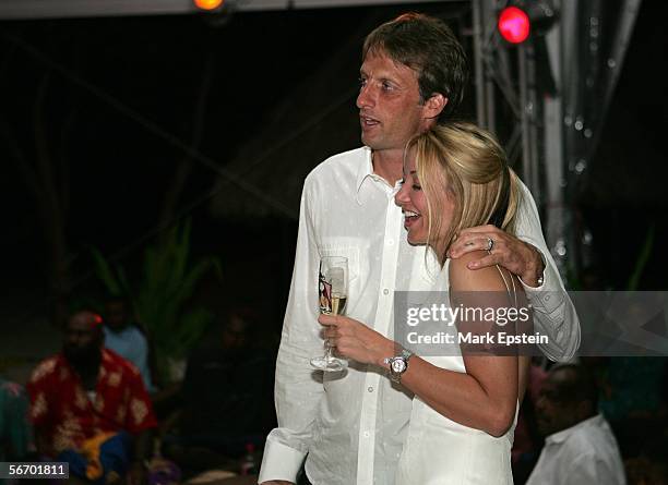 Newlyweds Tony Hawk and Lhotse Merriam look on as Rancid perform during their wedding reception January, 12 2006 on the Island of Tavarua in Fiji.