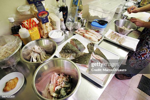 Different type of fishes are seen prior the preparation of the Rib of Turbot, with lager beer tempura, monk fish tripe sauce, wild herbs, fried...