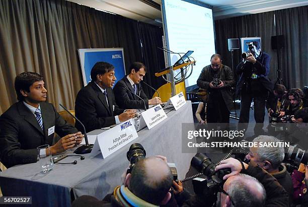 Lakshmi Mittal , the head of Mittal Steel who has launched a hostile takeover bid for European rival Arcelor, smiles next to his son, Aditya Mittal ,...