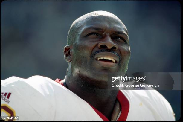 Defensive lineman Bruce Smith of the Washington Redskins on the sideline during a game against the Philadelphia Eagles at Veterans Stadium on October...