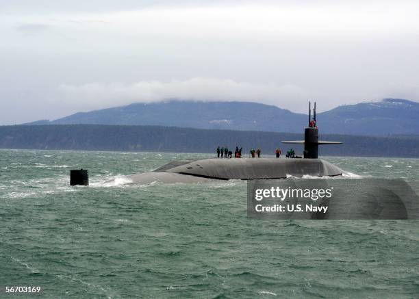 In this handout provided by the U.S. Navy, the guided missile submarine USS Ohio stops for a personnel boat transfer January 29, 2006 off the coast...