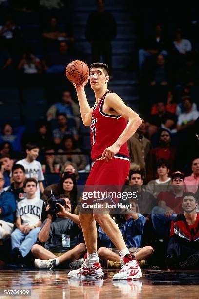 Gheorge Muresan of the Washington Bullets looks to pass the ball down court against the Miami Heat circa 1994 at Miami Arena in Miami, Florida. NOTE...