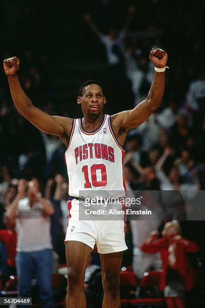 Dennis Rodman of the Detroit Pistons celebrates a win circa 1993 at The Palace in Auburn Hills in Auburn Hills, Michigan. NOTE TO USER: User...