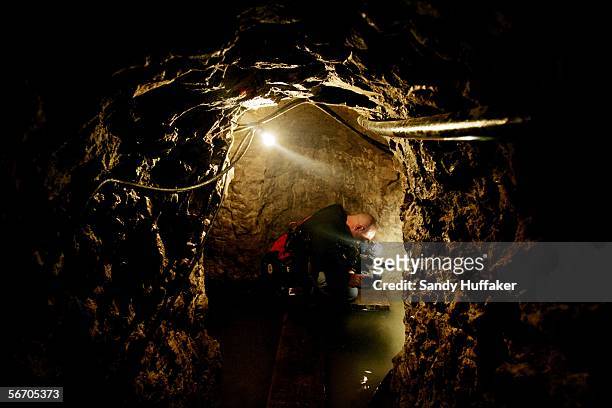 Cameraman Mike Gold films through a drug tunnel found along the Mexico/USA Border at a warehouse January 30, 2006 in Otay Mesa, California. The...