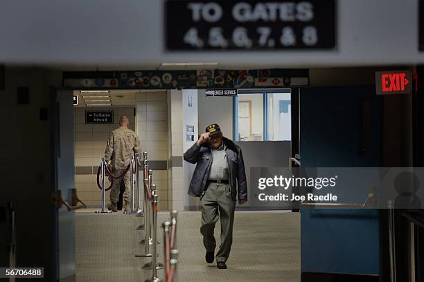 World War II veteran Bill Knight of the Maine Troop Greeters leaves after saying goodbye to the last Marine passing through the Bangor International...