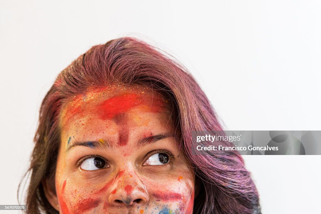 Girl with her hair and face covered in powders
