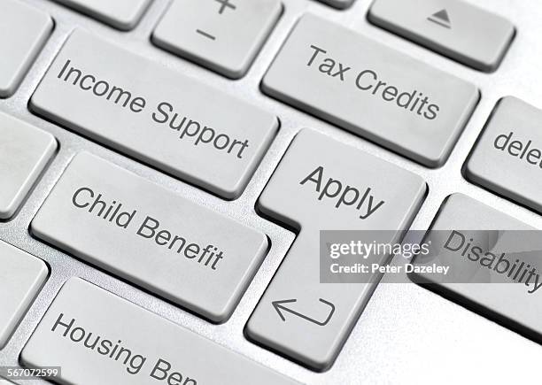 benefit and social security keyboard - welfare stock pictures, royalty-free photos & images