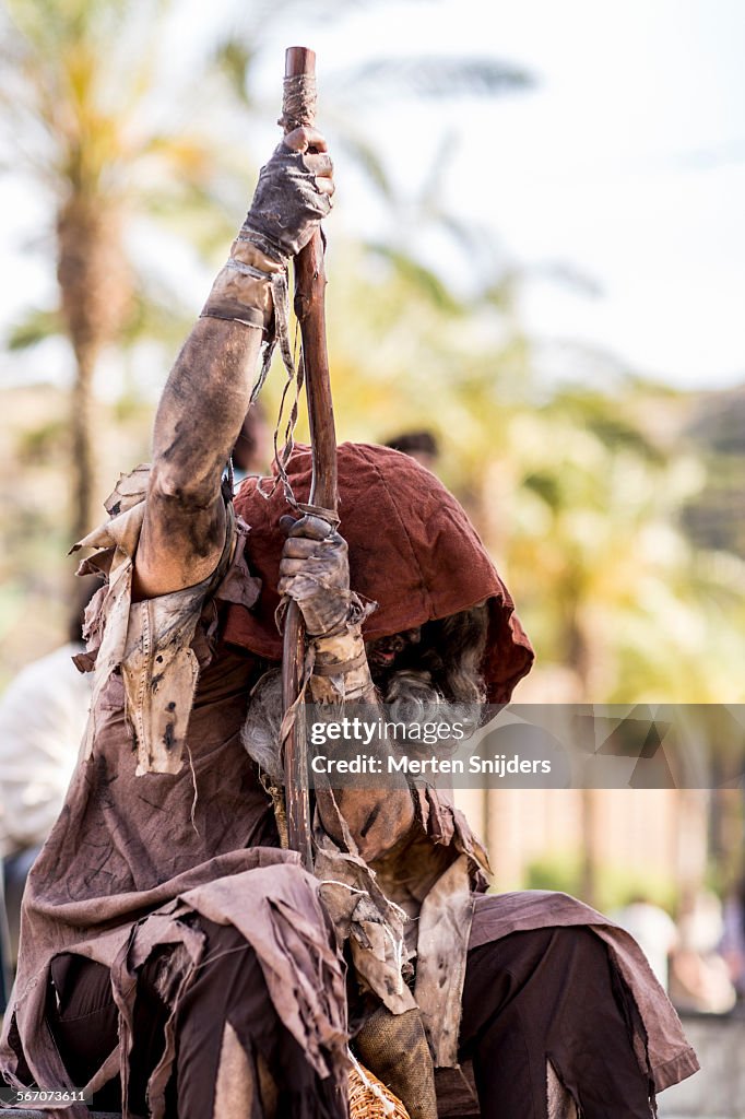 Rough looking vagabond with stick