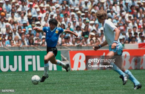 Diego Maradona of Argentina in action with the player of England during the World Cup quarter final match between Argentina and England on June 22,...