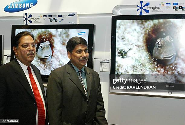 Deputy Managing Director, Samsung India Electronics, Ravi Zurshi and Director of Sales, Samsung India, Pradeep Tognatta pause during the launch of...