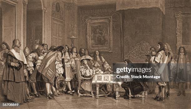 Engraving shows King Louis XIV of France , a patron of the arts, as he dines with French writer Moliere while his court watches, France, mid 1600s.