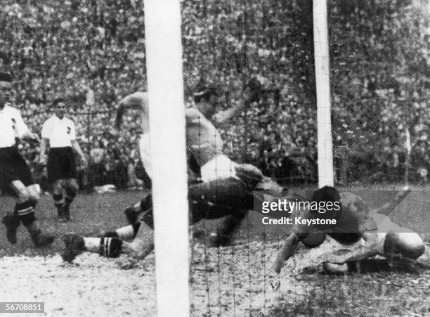 Enrico Guaita of Italy scores, ten minutes into his team's World Cup semifinal against Austria at San Siro, Milan, 3rd June 1934. Italy won the match...