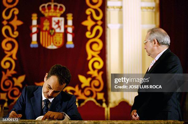 Spanish Prime Minister Jose Luis Rodriguez Zapatero signs the golden book by President of Melilla, Juan Jose Imbroda, 31 January 2006 during his...