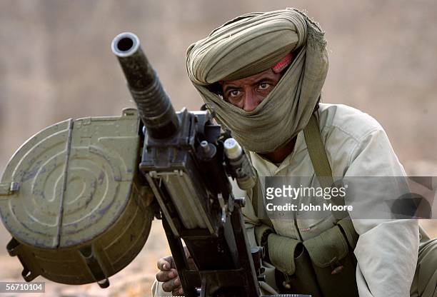 Marri tribal guerrilla prepares to fire a grenade launcher at a Pakistani troop outpost January 31, 2006 near Kahan in the Pakistani province of...