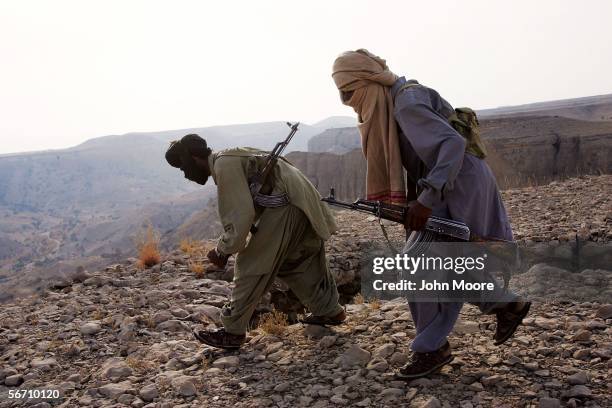 Marri tribal guerrillas prepare to attack a Pakistani troop outpost January 31, 2006 near Kahan in the Pakistani province of Balochistan. The rebels...