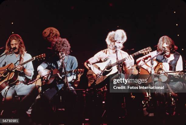 Members of the American soft-rock ensemble The Eagles sit on chairs as the perform on the television show 'Don Kirschner's Rock Concert,' 1979....