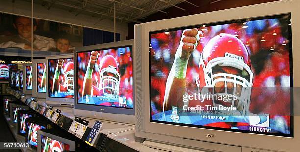 Flat-panel wide screen televisions display a football player a Best Buy store January 31, 2006 in Niles, Illinois. Sales of televisions are...